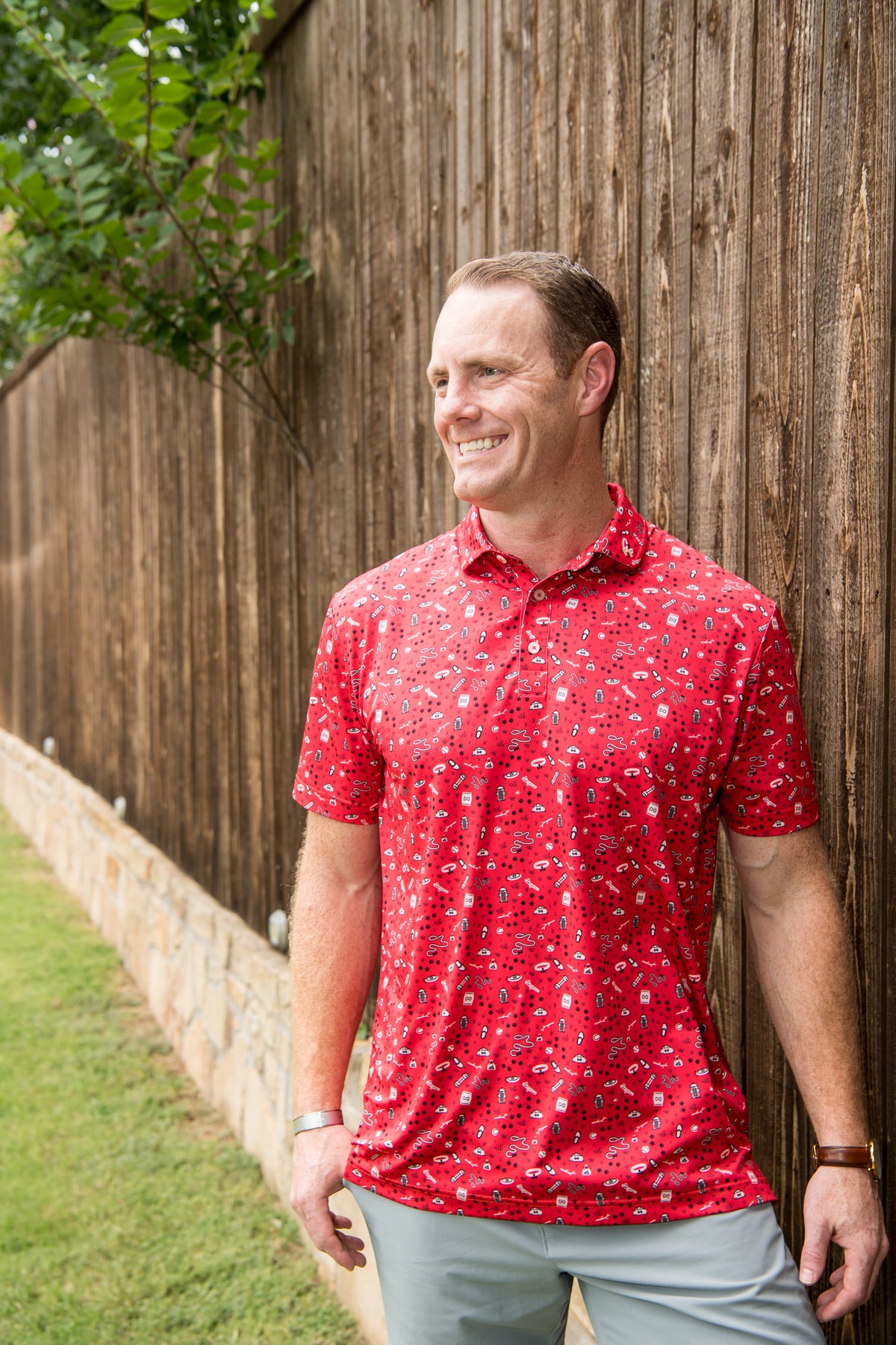 Taste of Freedom Red lifestyle — a man wears the exact red patriotic-pattern polo outdoors.